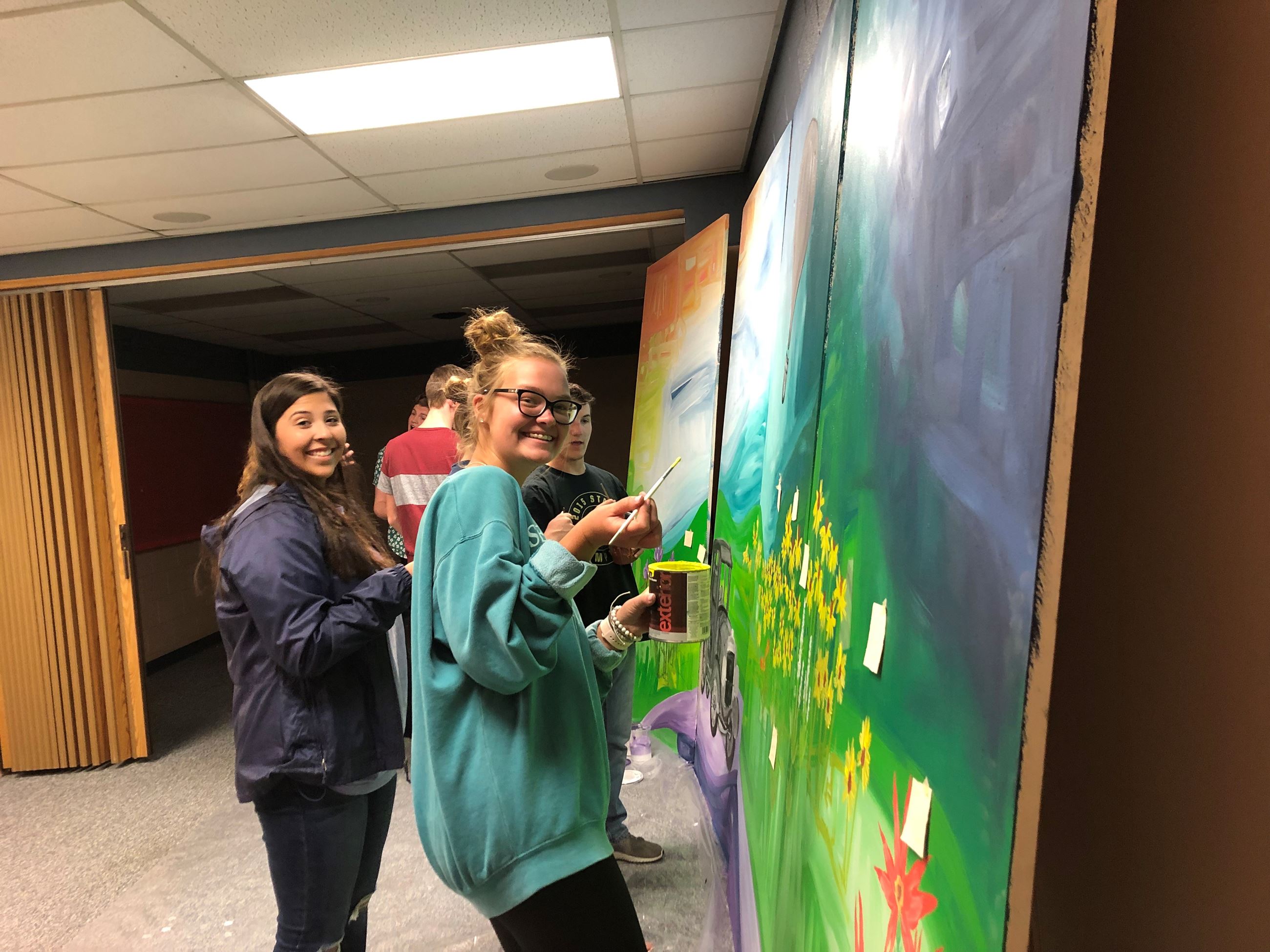 Students painting art panels